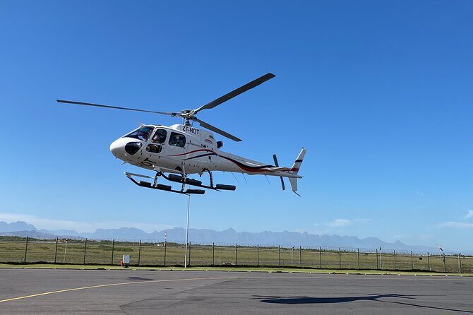 Cape Town: 25min Helicopter Flight with Complimentary Boat Cruise - Muizenberg from the air: the shark-spotting moment