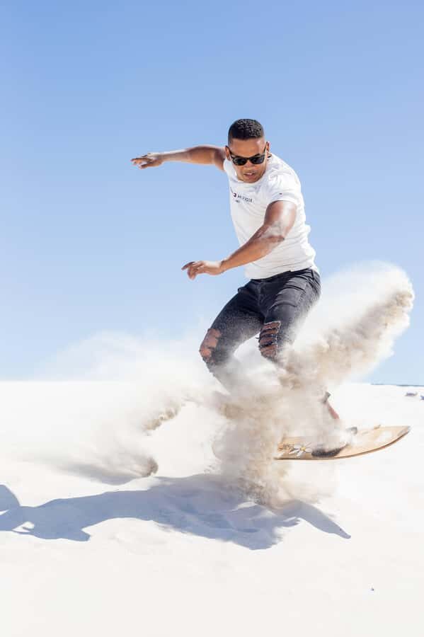Cape Town: Atlantis Dunes Quad Bike & Free Sandboarding Tour - Sandboarding on the white slopes: the included thrill, plus the walk back note