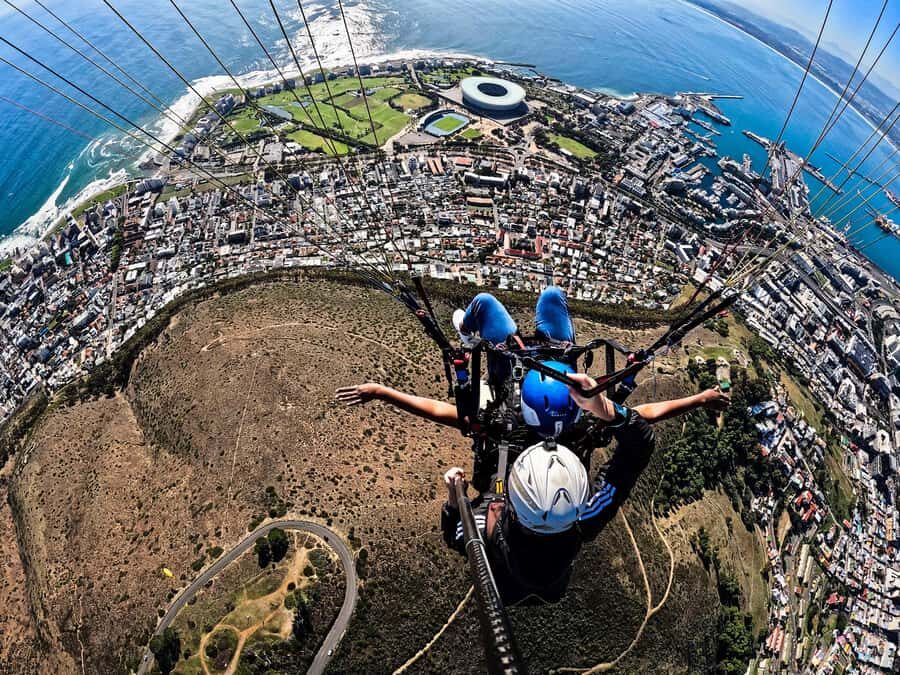 Cape Town: Tandem Paragliding with views of Table Mountain - Landing and the Two Endpoints: Promenade vs The Glen Club