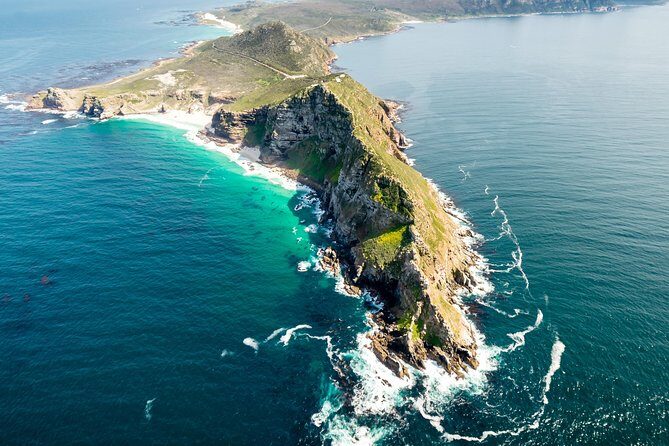 Full Peninsula Scenic Helicopter Flight with Free Boat Cruise - Cape Point and Cape of Good Hope: cliffs, waves, and the lighthouse pass